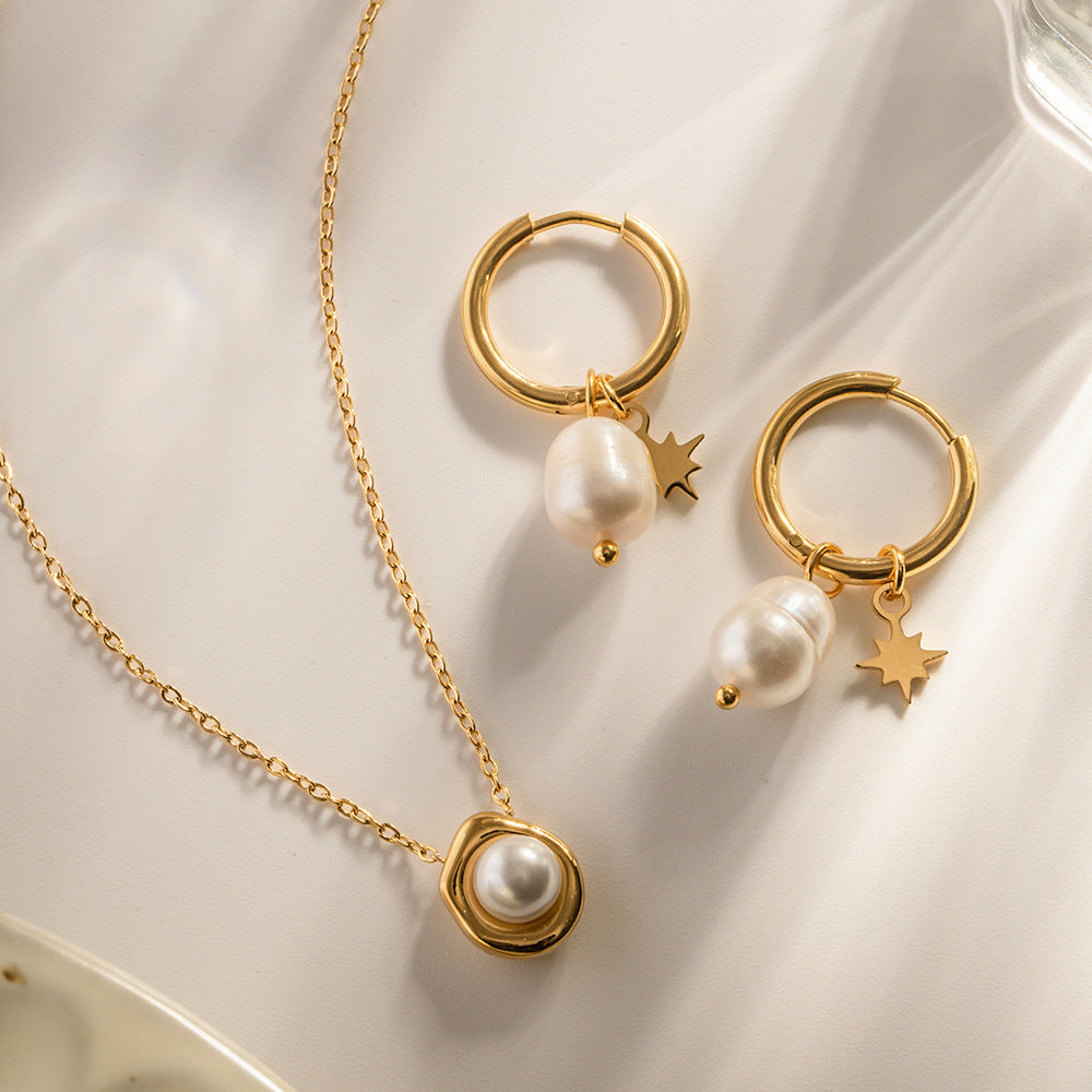 Gold star and freshwater pearl drop earrings