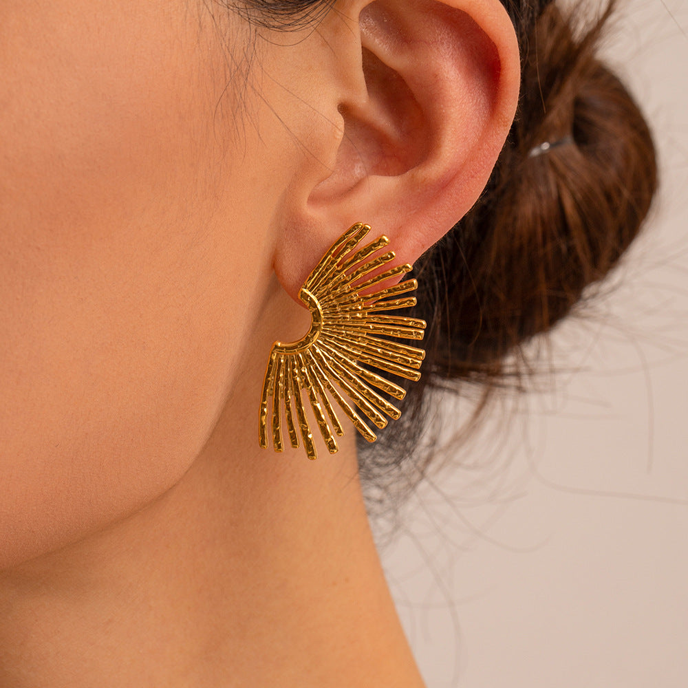 Gold sunburst earrings in stainless steel